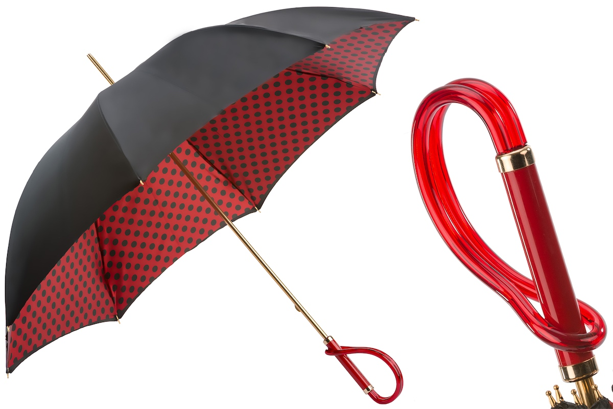 Black and red dotted rain umbrella by Pasotti with a double cloth canopy and durable acetate handle, open to show the elegant design.