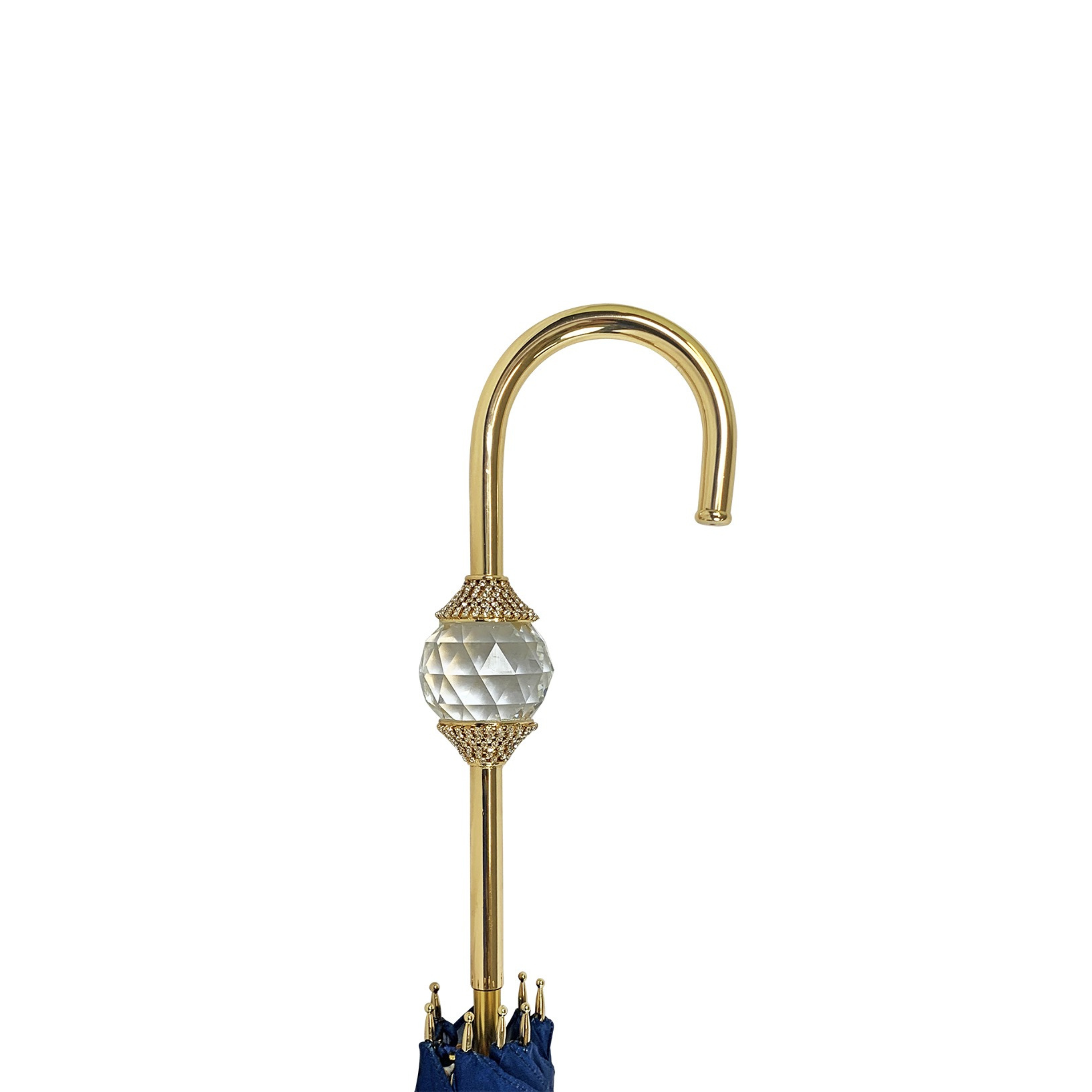 Navy blue luxury umbrella featuring a Swarovski crystal sphere handle by Ilmarchesato, open against a light background.