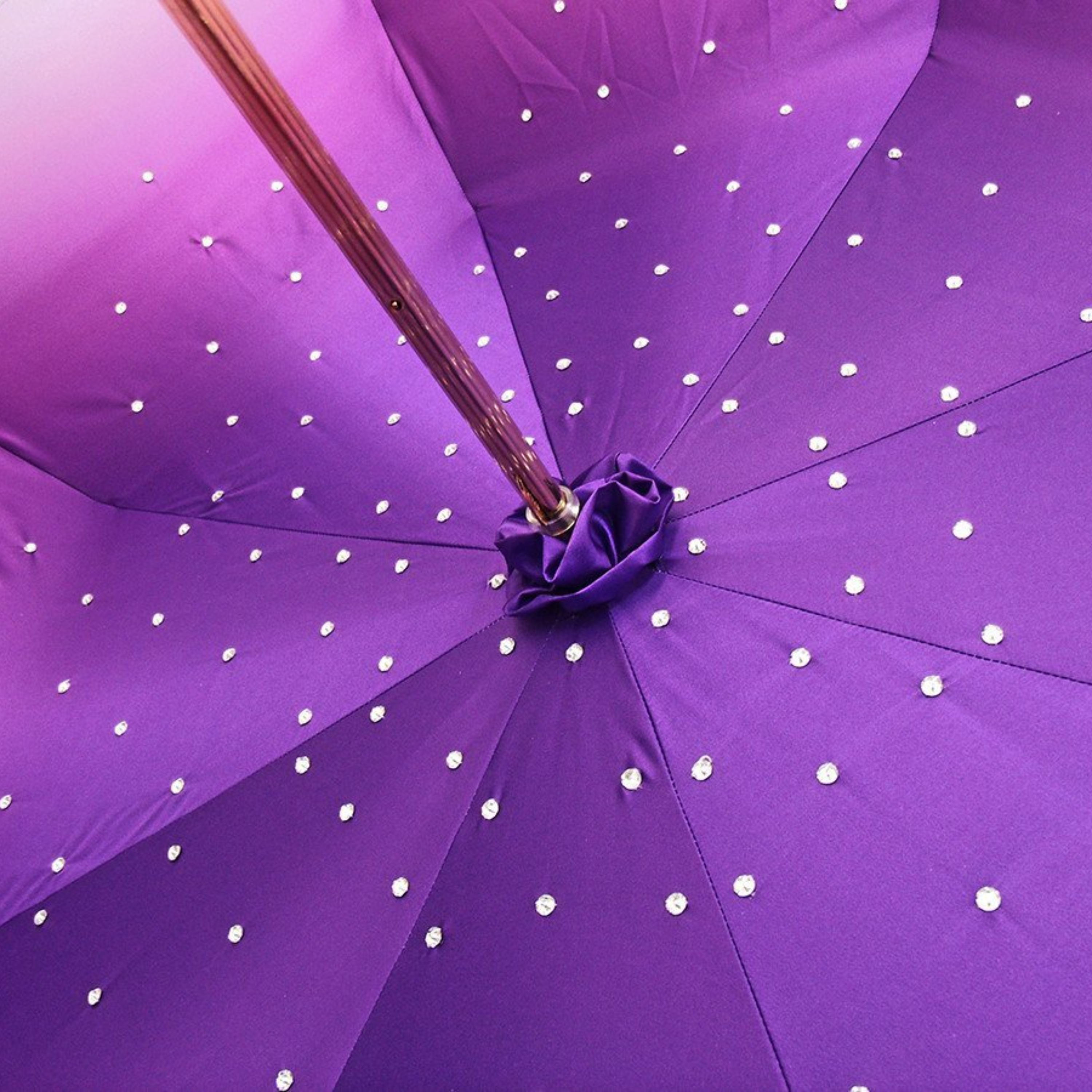 Purple luxury double canopy umbrella by Ilmarchesato adorned with Swarovski crystals, elegantly displayed open.