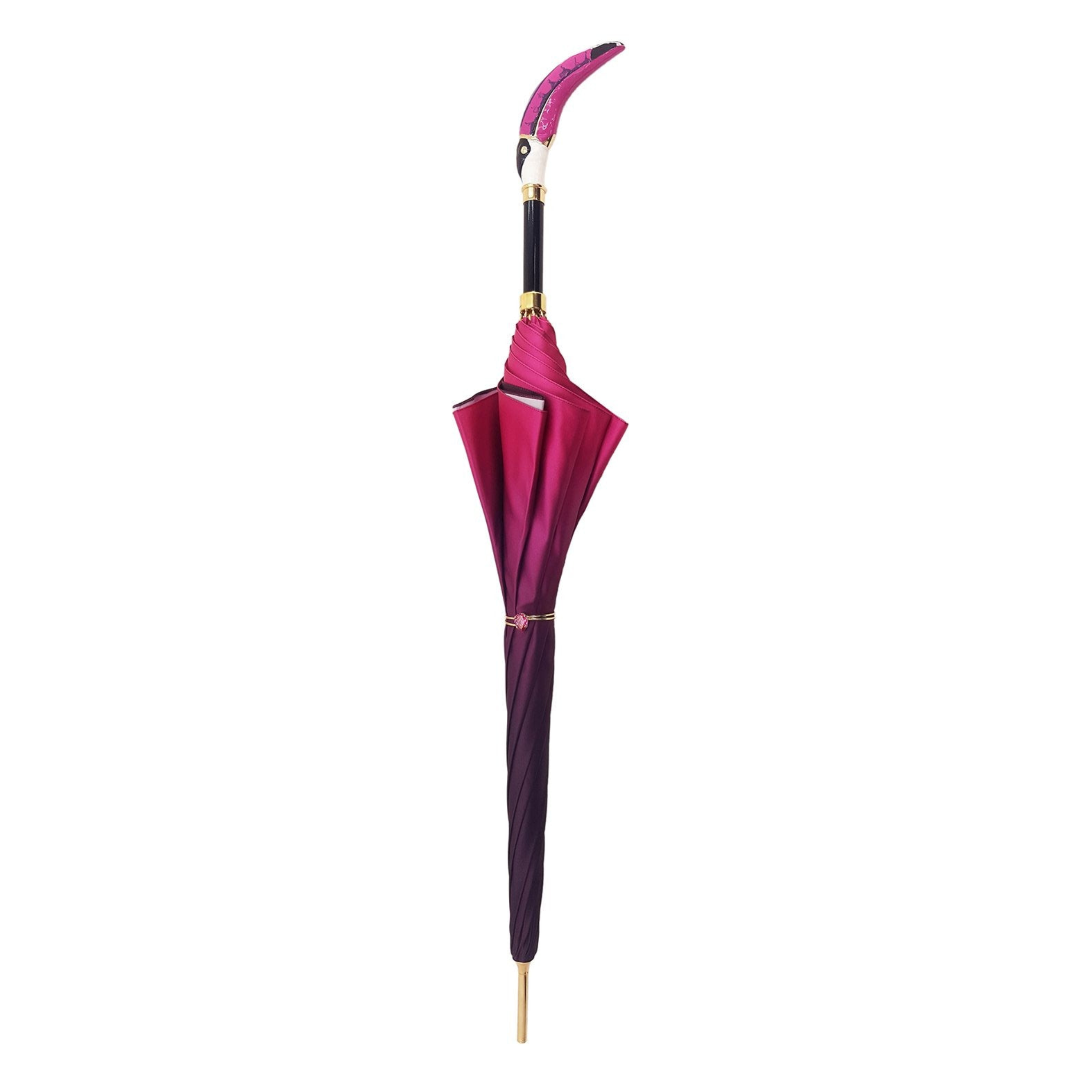 Double canopy Toucan umbrella by Ilmarchesato with a gradient fuchsia rain umbrella featuring a vibrant toucan design.