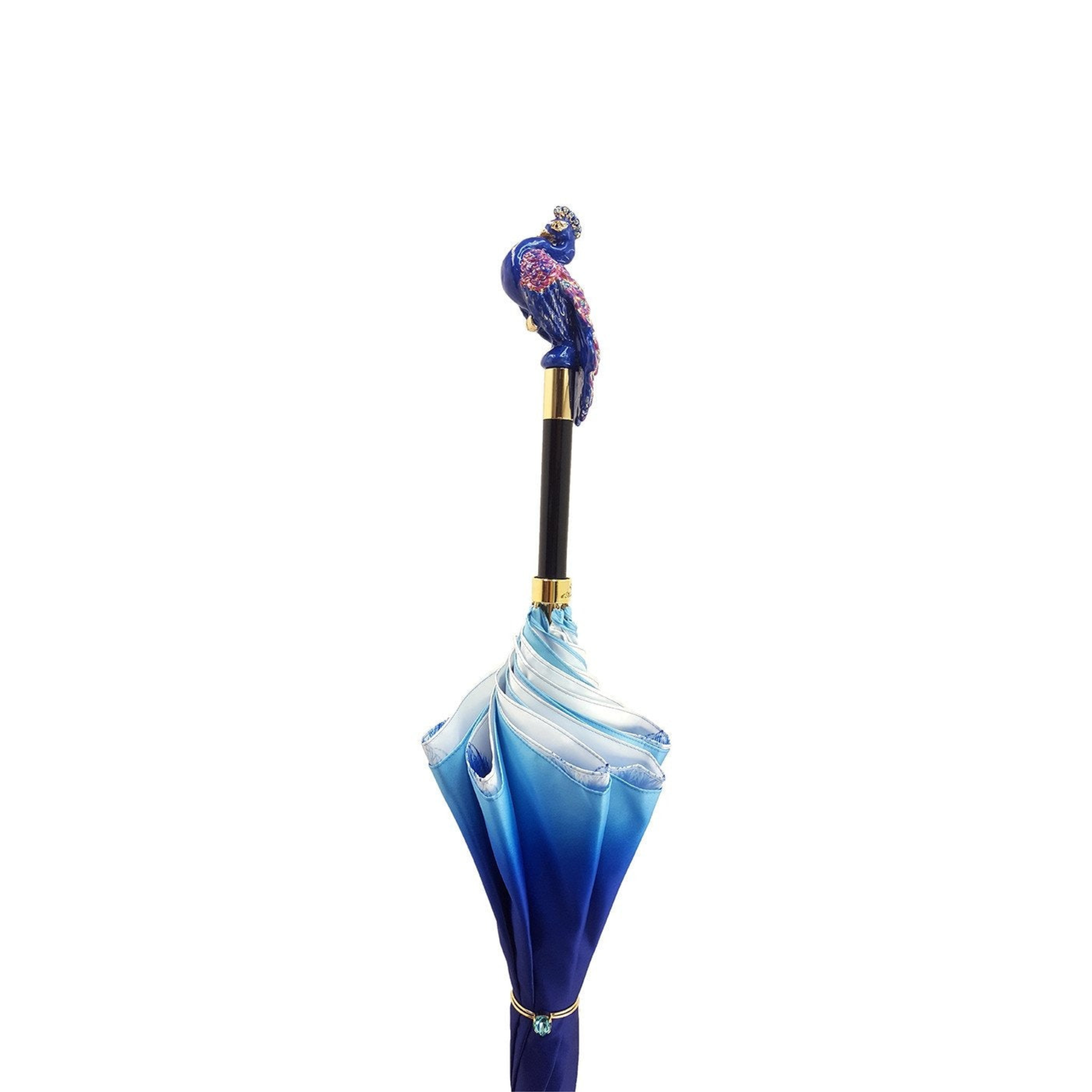 Blue peacock luxury rain umbrella by Ilmarchesato with Swarovski crystal handle, featuring intricate peacock feather design.
