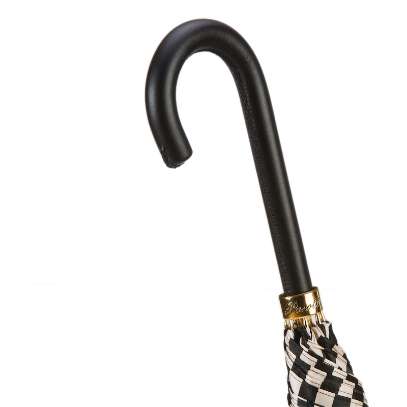 Handmade Italian black and white striped rain umbrella with leather handle by Pasotti, showcasing its elegant design.