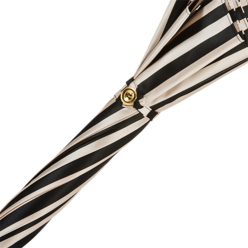 Handmade Italian black and white striped rain umbrella with leather handle by Pasotti, showcasing the elegant design and craftsmanship.