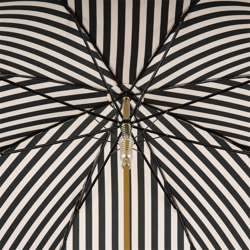 Handmade Italian black and white striped rain umbrella by Pasotti with leather handle, showcasing elegant craftsmanship and classic design.