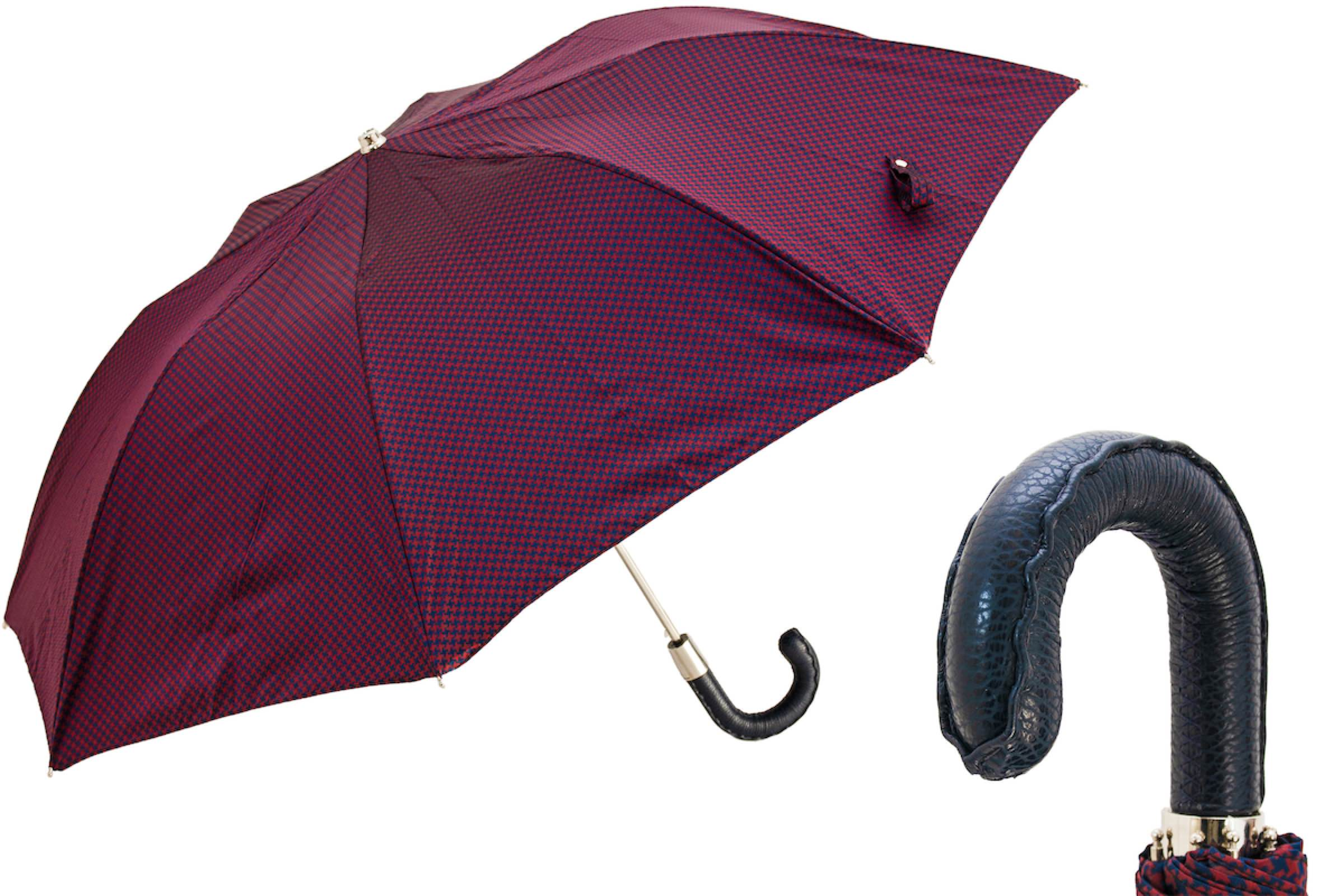 Folding Pasotti umbrella with Italian handmade leather handle, compact rain gear, black canopy, lightweight and stylish.