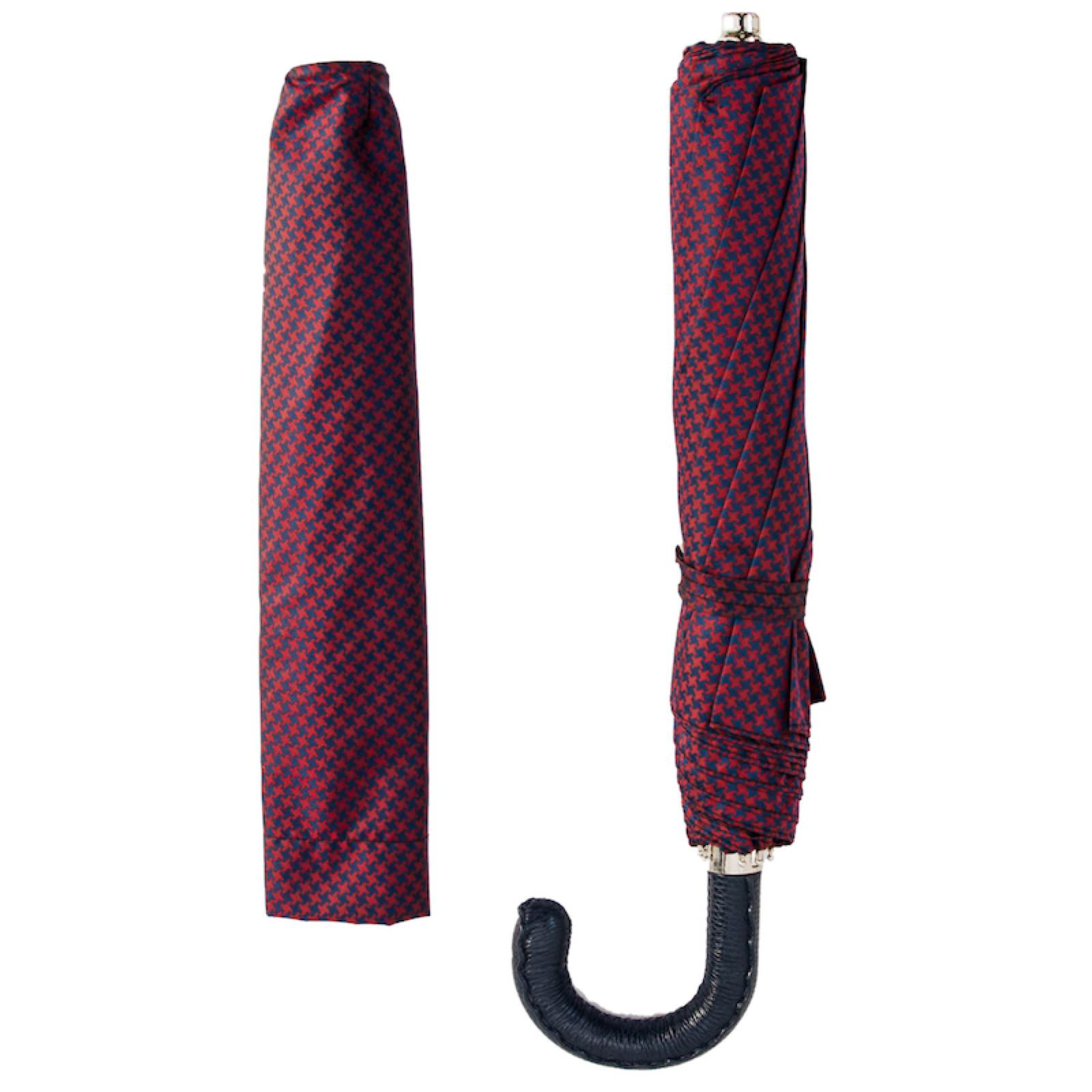 Folding Pasotti umbrella with Italian handmade leather handle, compact rain gear, black canopy, and automatic opening mechanism.