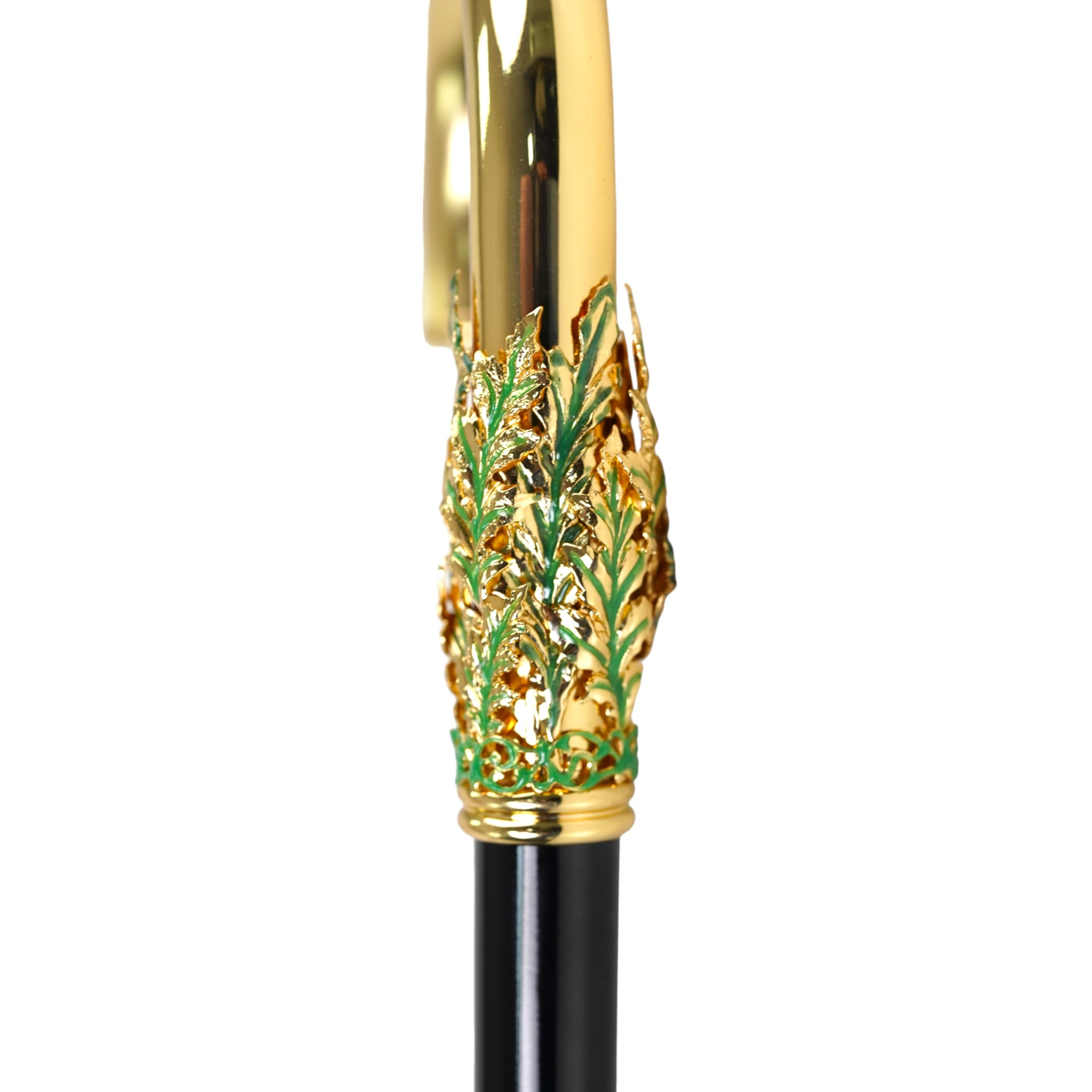 Handcrafted 24K gold walking cane with leaf handle by Ilmarchesato, showcasing elegant Italian artisan craftsmanship.