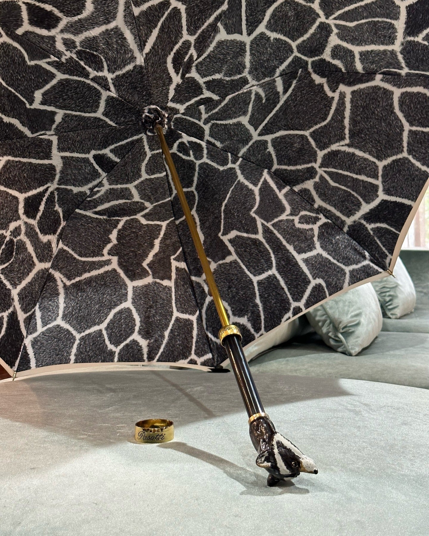 Handmade Italian rain umbrella by Pasotti with a luxury raccoon handle and elegant design.