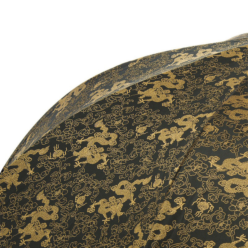 Luxury golden dragon umbrella by Pasotti, featuring a modern Italian design and elegant craftsmanship for men.