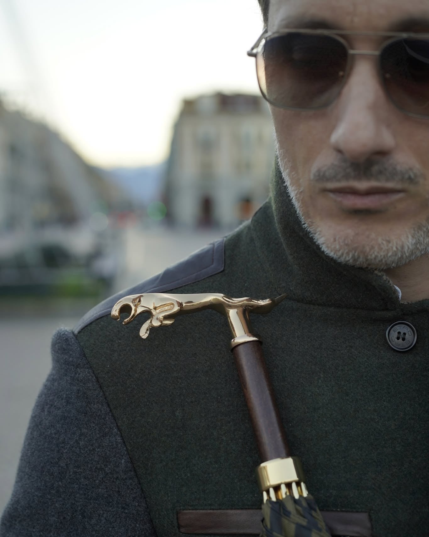 Black pinstripe men's umbrella by Ilmarchesato with 24K gold handle, automatic opening, and luxury rain gear design.