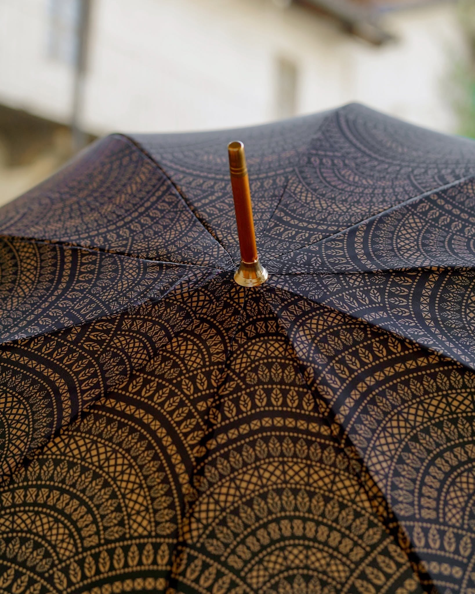 Men's Ilmarchesato umbrella with gold-plated greyhound handle and decorative design, stylish accessory for rainy days.