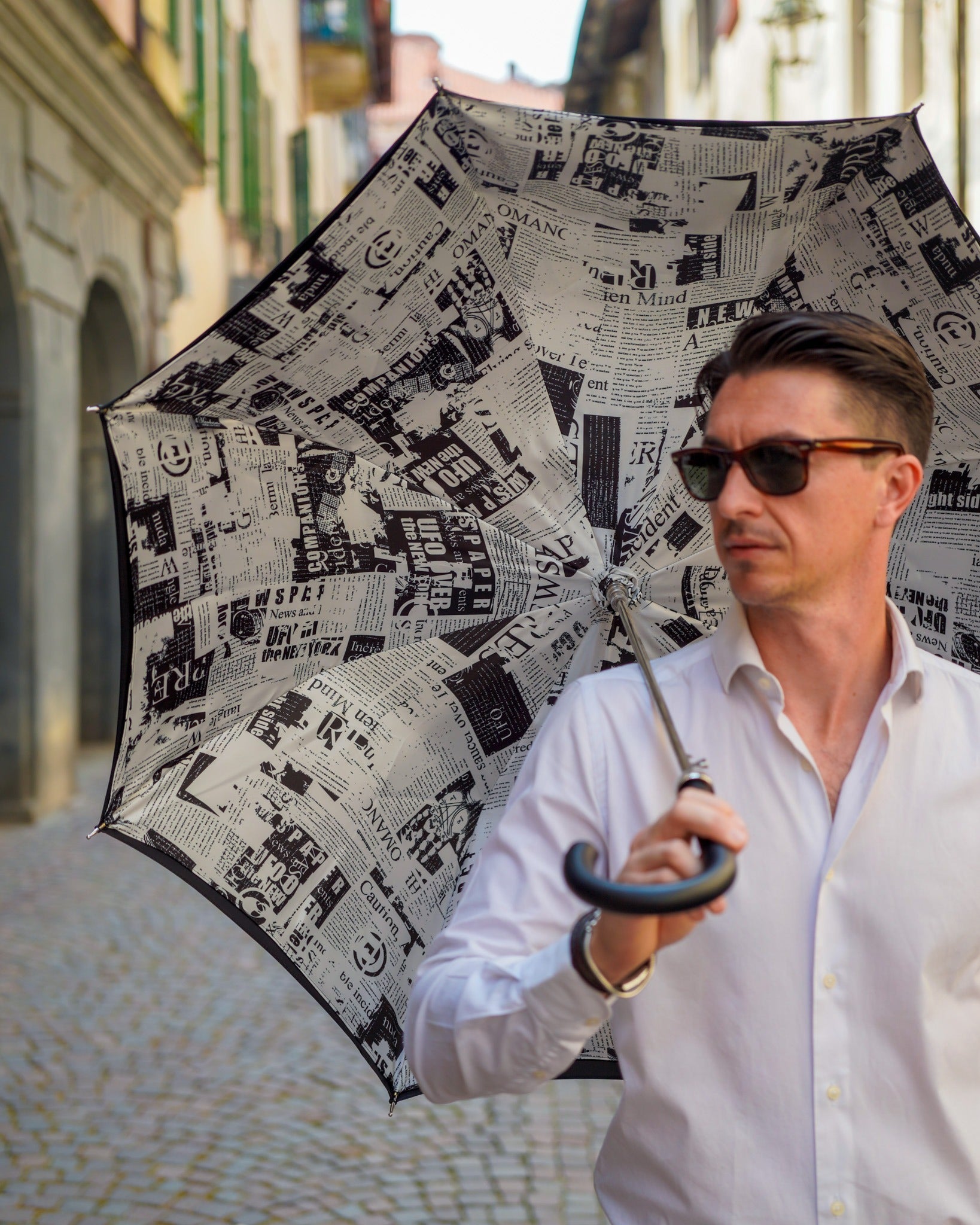 Luxury Italian Ilmarchesato rain umbrella with leather handle, handmade wind-resistant design, perfect for rainy weather.