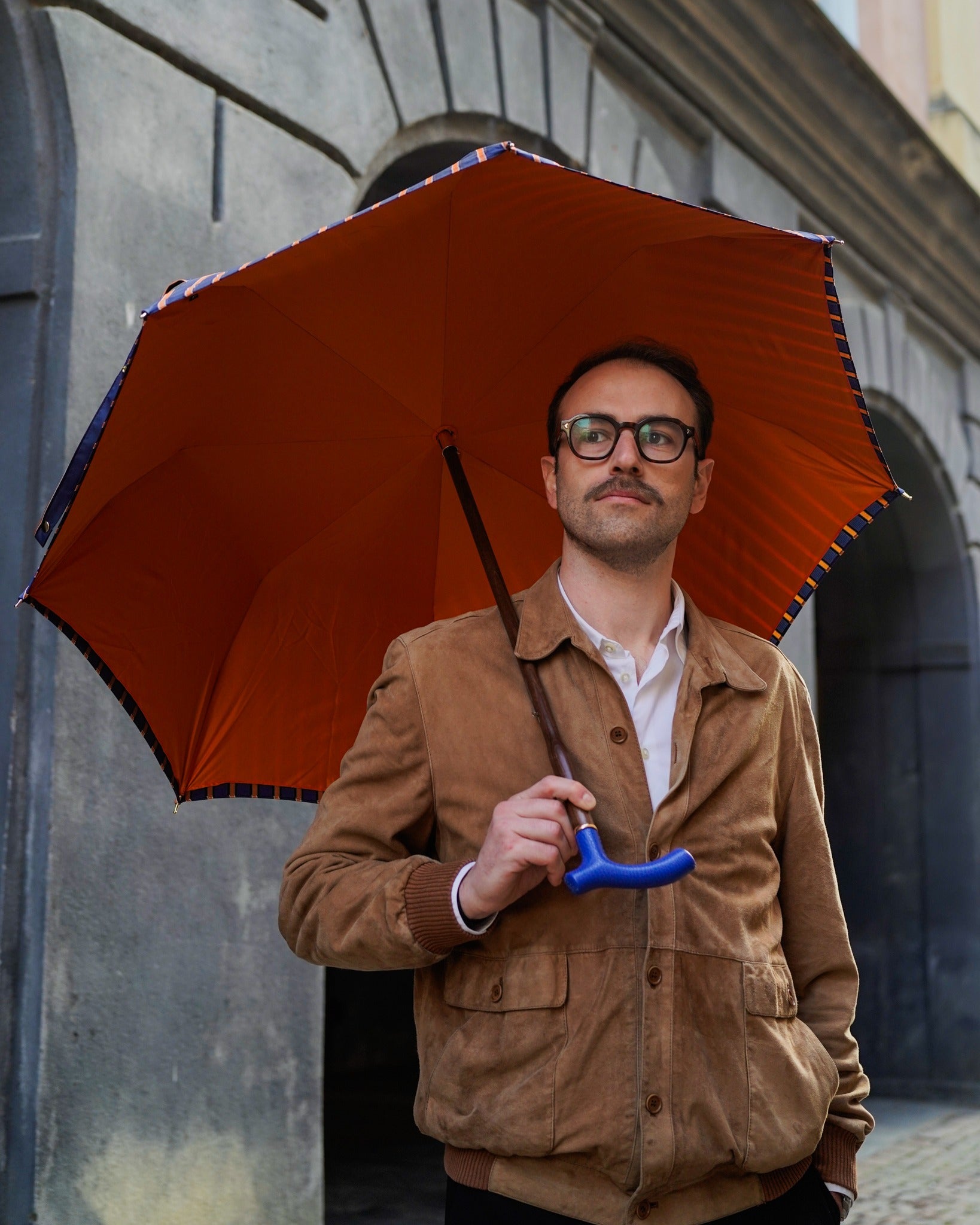 Orange striped men's umbrella with handcrafted leather handle, Italian-made luxury rain umbrella by Ilmarchesato.