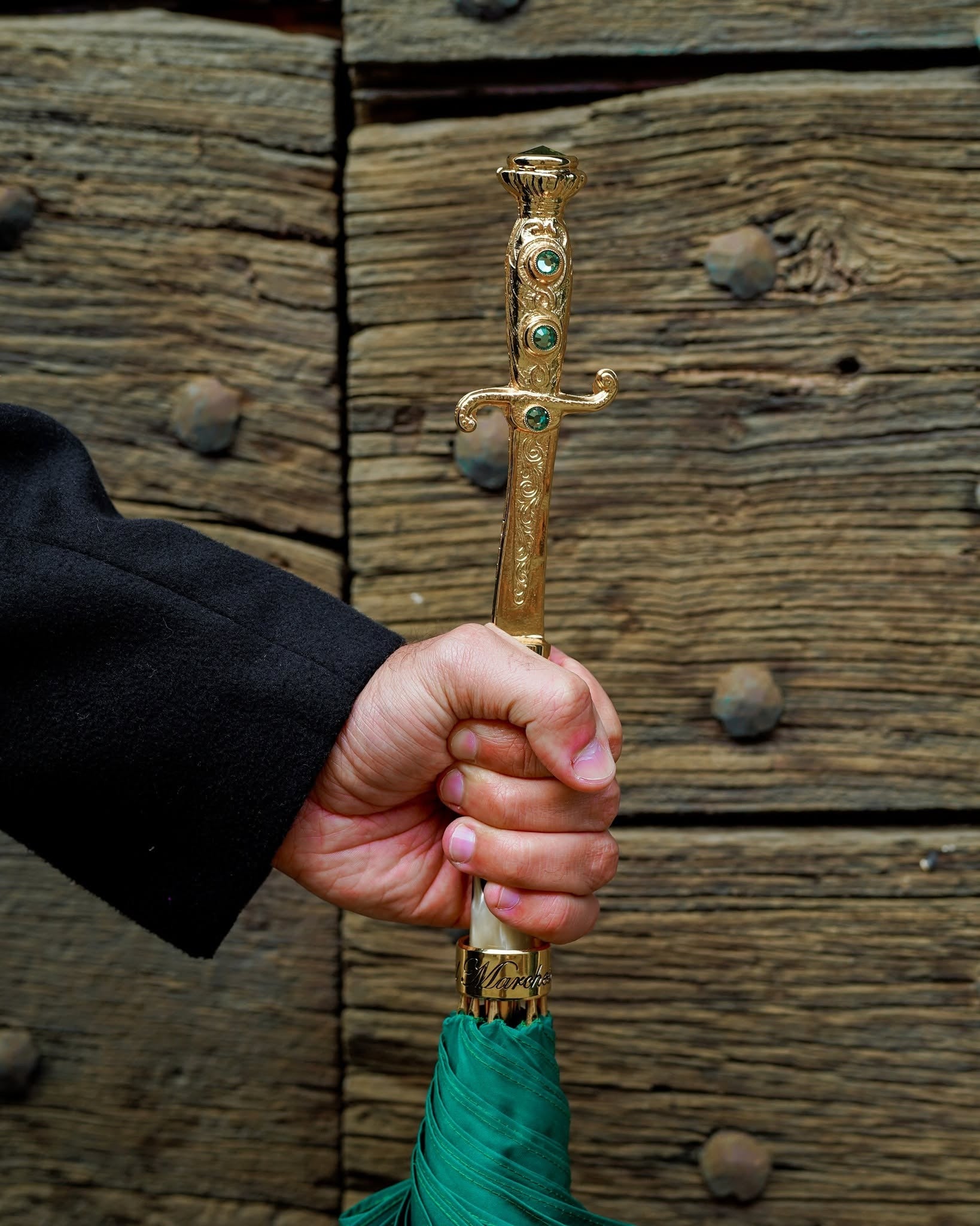 Men's green luxury automatic umbrella with 24K gold sword handle by Ilmarchesato, featuring a sturdy canopy and elegant design.