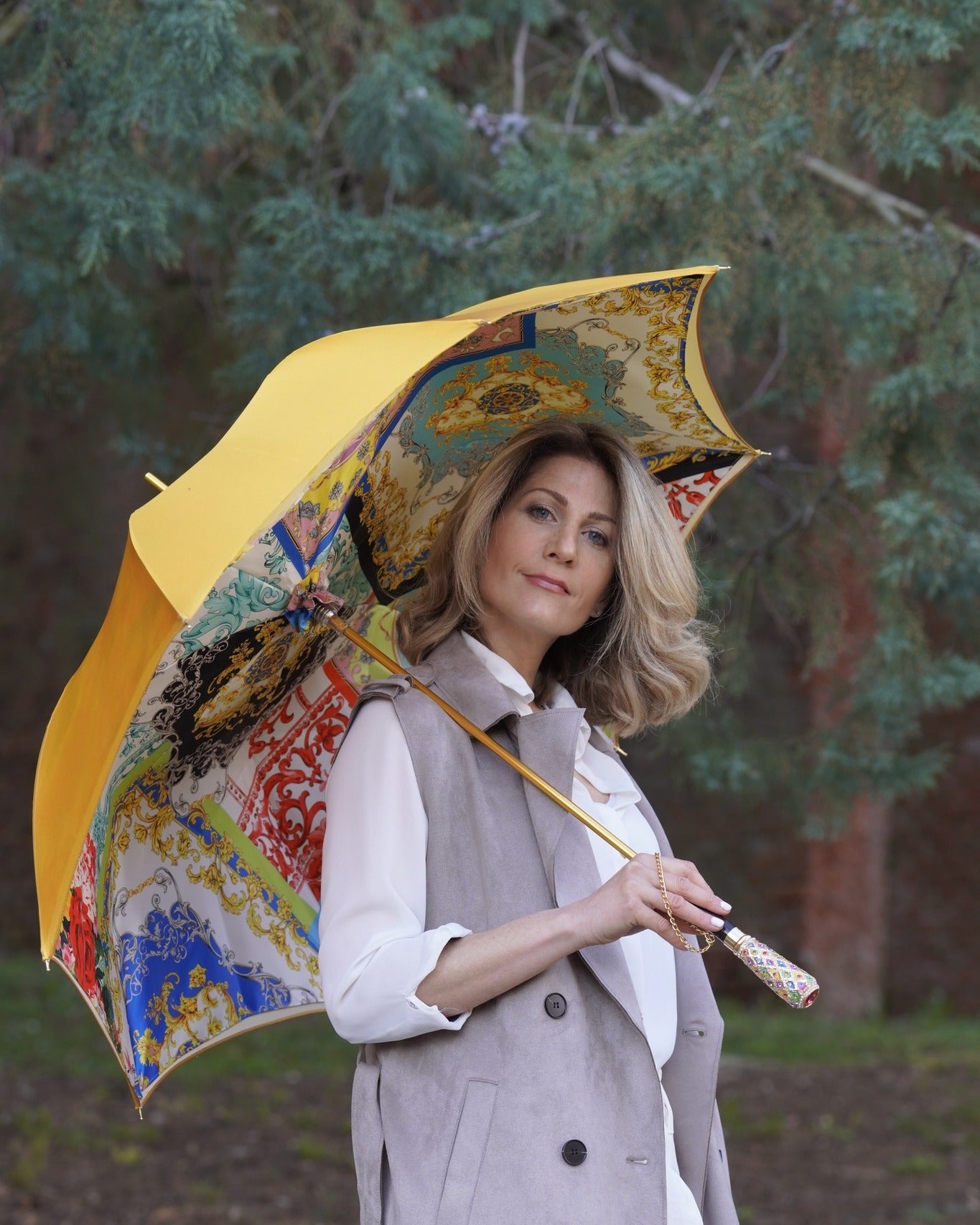 Luxury Italian rain umbrella by Ilmarchesato with satin canopy and hand-painted 24K gold handle, open to show elegant design.