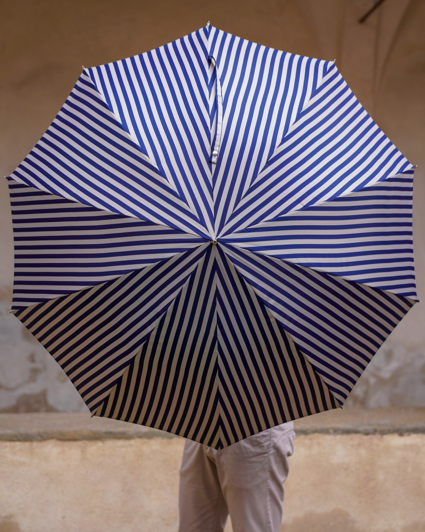 Men's luxury striped umbrella by Ilmarchesato with silverplated handle and crystal accents, featuring a stylish, durable rain protection design.