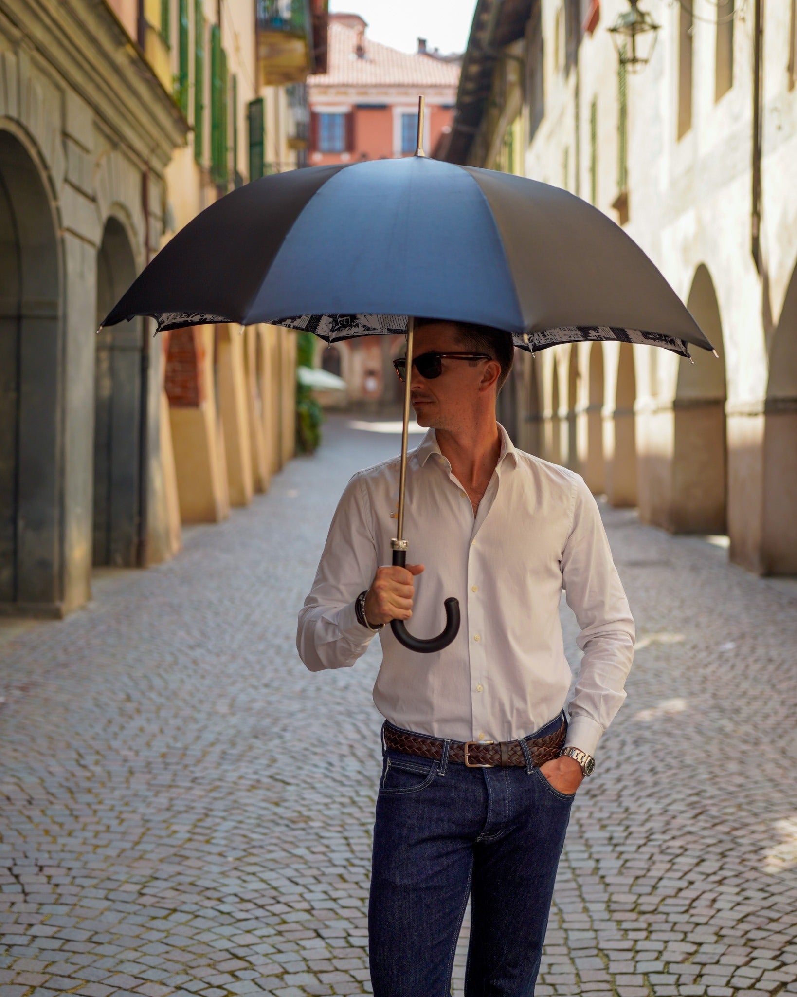 Luxury Italian Ilmarchesato rain umbrella with wind-resistant design and leather handle, showcasing its elegant canopy and craftsmanship.