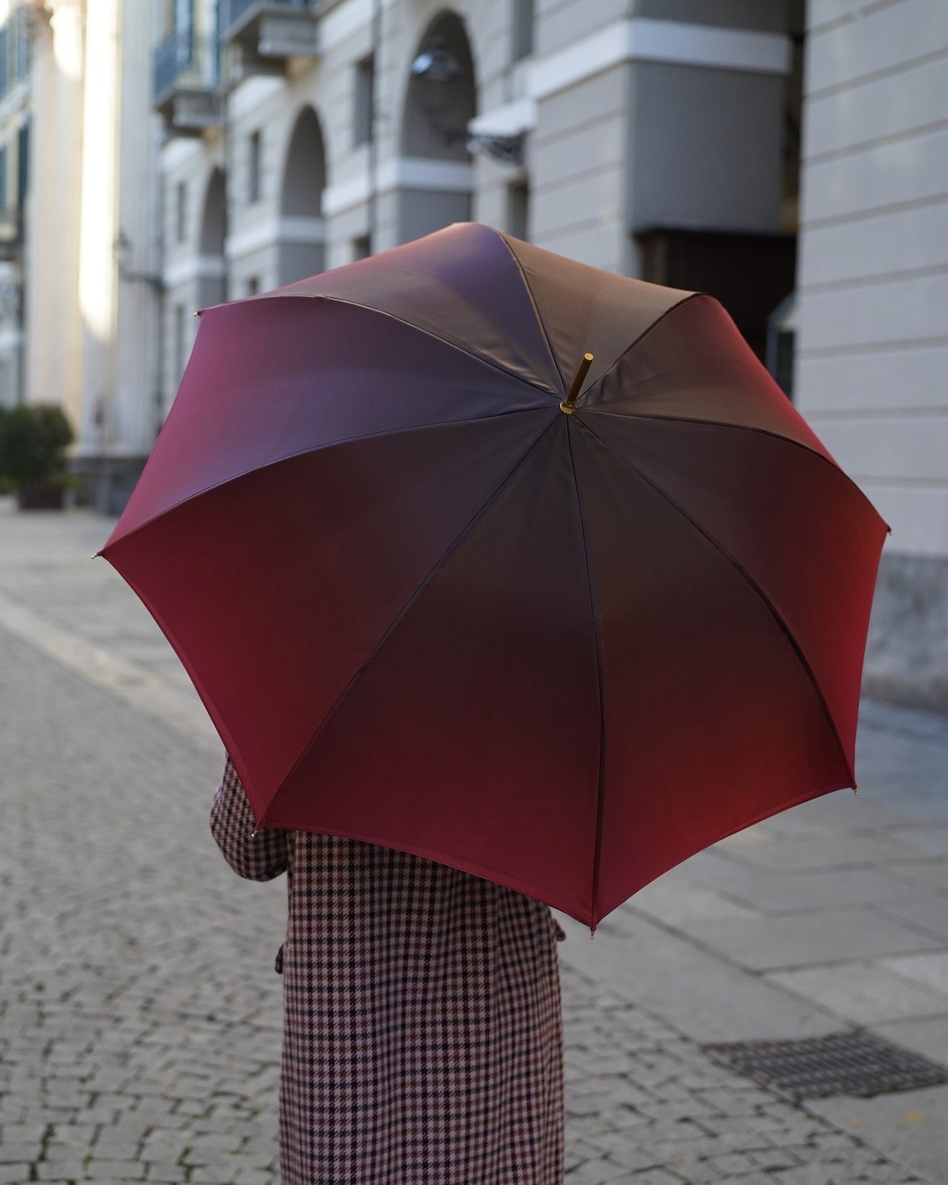 Luxury Burgundy Ilmarchesato rain umbrella with automatic opening, regal crown design, and red stone handle.