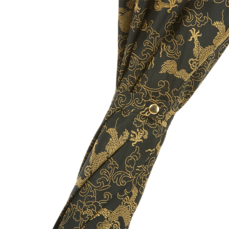 Luxury Pasotti golden dragon umbrella with modern Italian design, displayed in an elegant gift box.