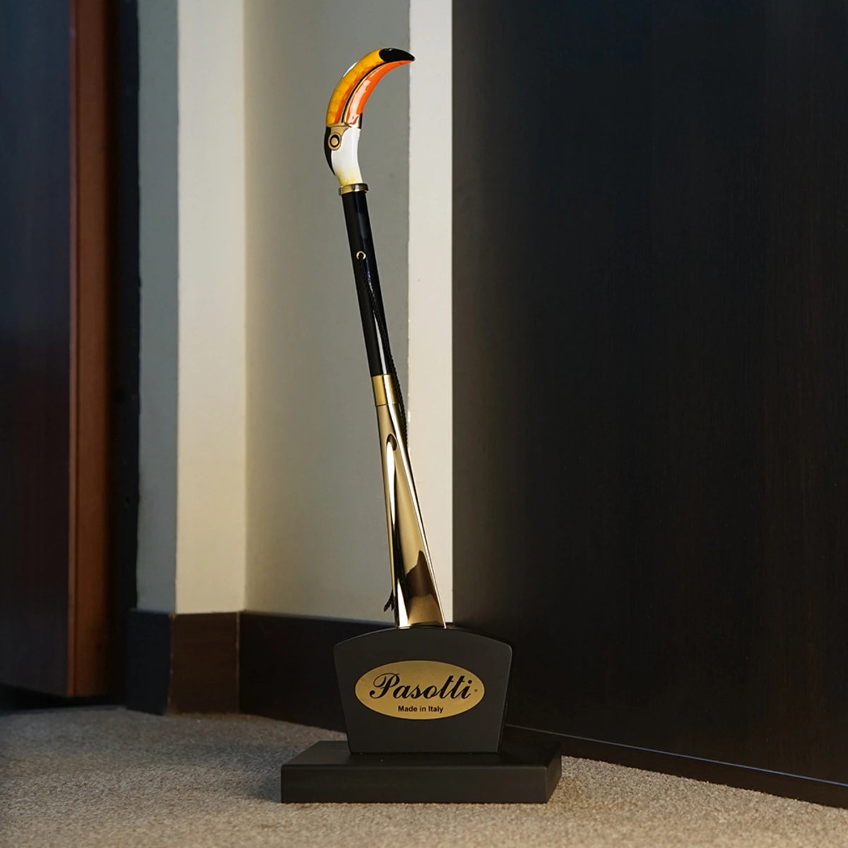 Handmade Pasotti toucan shoehorn with an enameled brass handle, showcasing intricate design and craftsmanship.