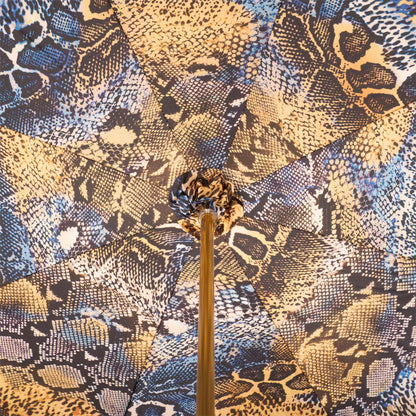 Snake print luxury rain umbrella with sculpted brass handle, featuring a stylish design and sturdy construction by Ilmarchesato.