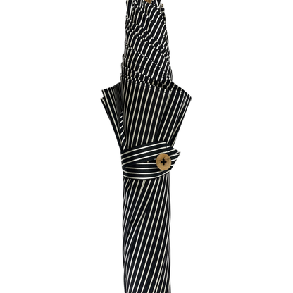 Black and white bespoke men's umbrella with hand-curved Malacca wood handle, designed for elegant protection.