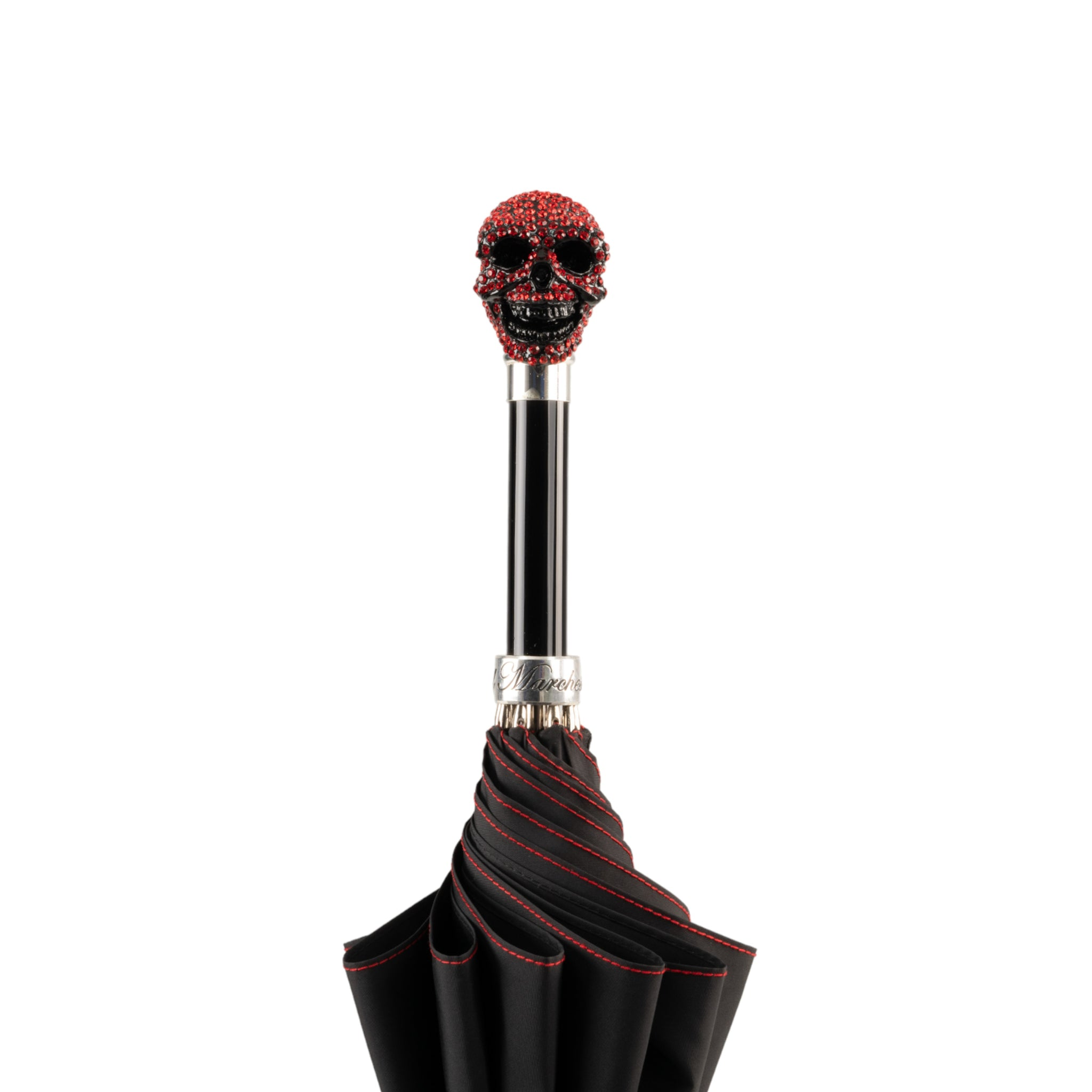 Luxury skull umbrella for men by Ilmarchesato with Light Siam crystal handle, featuring a dark canopy and intricate skull design.