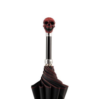 Luxury skull umbrella for men by Ilmarchesato with Light Siam crystal handle, featuring a dark canopy and intricate skull design.