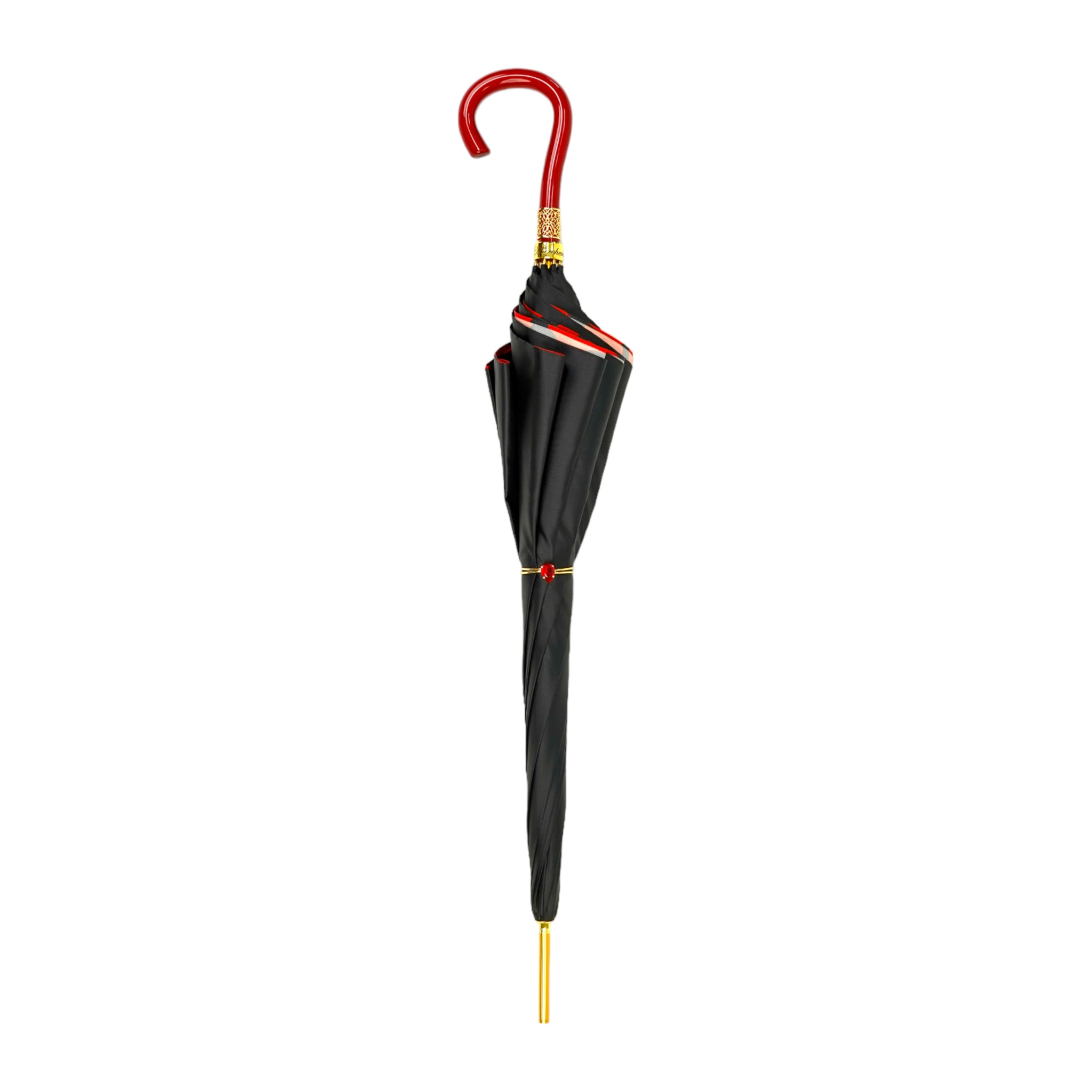 Black and red couture rain umbrella with gold filigree handle, featuring elegant fabric and intricate handle design.