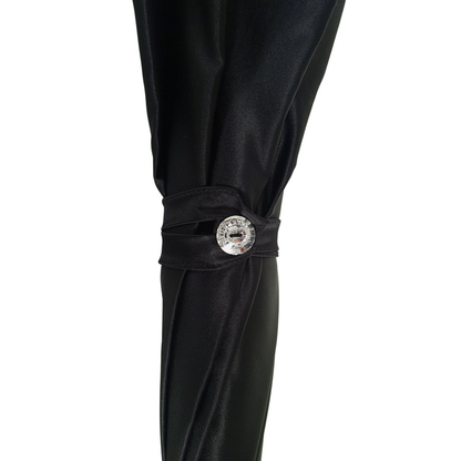 Ilmarchesato multicolored double canopy umbrella featuring a Swarovski handle, elegantly opened against a neutral background.