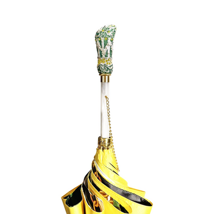 Yellow gold luxury rain umbrella with hand-enameled crystal handle by Ilmarchesato, showcasing intricate design details.