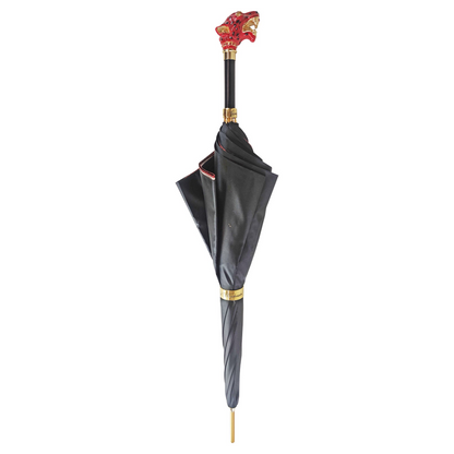 Red leopard print luxury umbrella with a Swarovski crystal handle by Ilmarchesato, showcasing its stylish design.