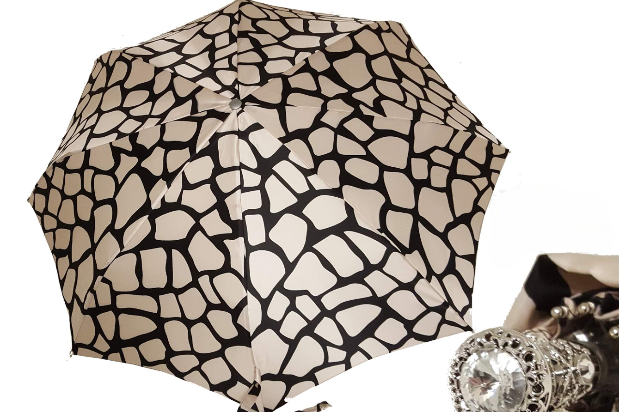 Ilmarchesato designer lightweight black and cream women's folding umbrella opened, showcasing its stylish pattern and compact design.