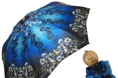 Blue floral women's folding umbrella with gold handle, compact design, featuring vibrant flower pattern and elegant 24K gold accents.