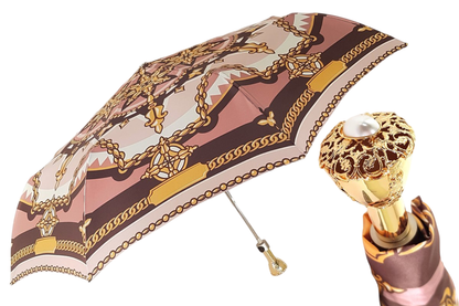 Chain print women's folding umbrella by Ilmarchesato with a 24K jeweled handle, shown open with chain pattern fabric and decorative handle