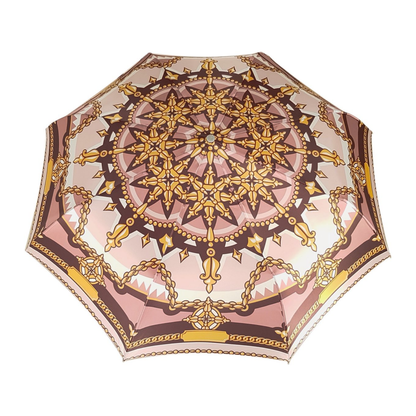 Chain print women's folding umbrella by Ilmarchesato with a 24K jeweled handle, compact design and patterned canopy.