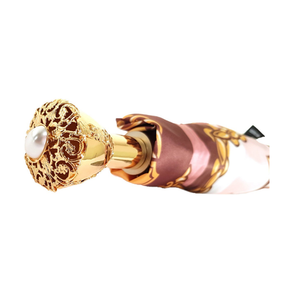 Chain print women's folding umbrella with 24K jeweled handle and compact design, stylish and functional for rainy days.