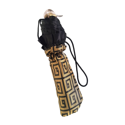 Automatic women’s folding umbrella with black ruffle and Greek design by Ilmarchesato, showing the stylish patterned canopy.