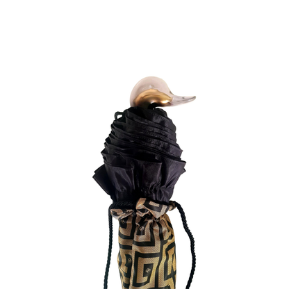 Automatic women's folding umbrella with black ruffle and Greek design, compact and stylish for rain protection.
