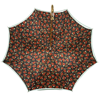 Gradient green luxury umbrella featuring an enamel rose handle by Ilmarchesato, open against a neutral background.