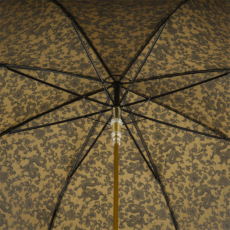 Automatic luxury umbrella featuring a golden dragon design by Pasotti, showcasing modern Italian craftsmanship for men.