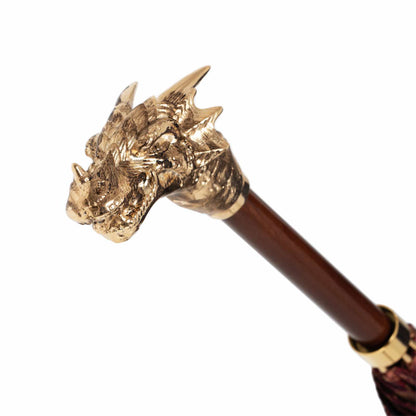 Luxury Pasotti burgundy umbrella with golden dragons, featuring automatic opening and elegant Italian craftsmanship.