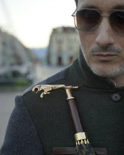 Black pinstripe men's umbrella by Ilmarchesato with 24K gold handle, automatic opening, and luxury rain gear design.