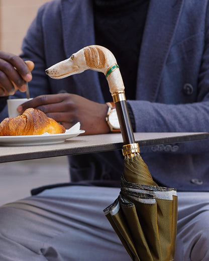 Men's umbrella with hand-painted design and 24K gold-plated greyhound handle by Ilmarchesato, showcasing an elegant, detailed handle.