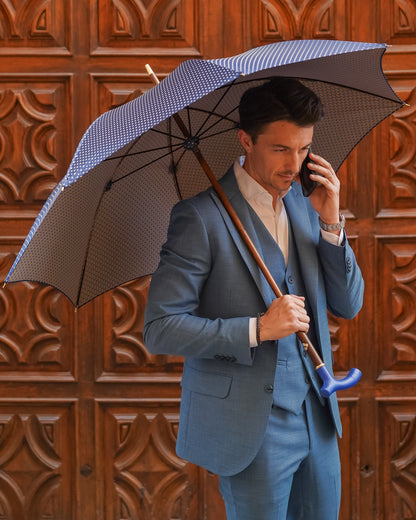 Blue leather handle men's designer umbrella by Ilmarchesato with flamed beech wood shaft, luxury rain gear and elegant craftsmanship.