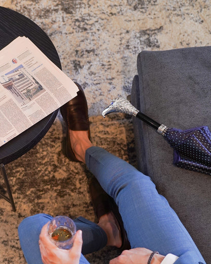Elegant handmade Italian men's umbrella with silver-plated hawk handle, featuring a sleek fabric canopy and detailed craftsmanship.