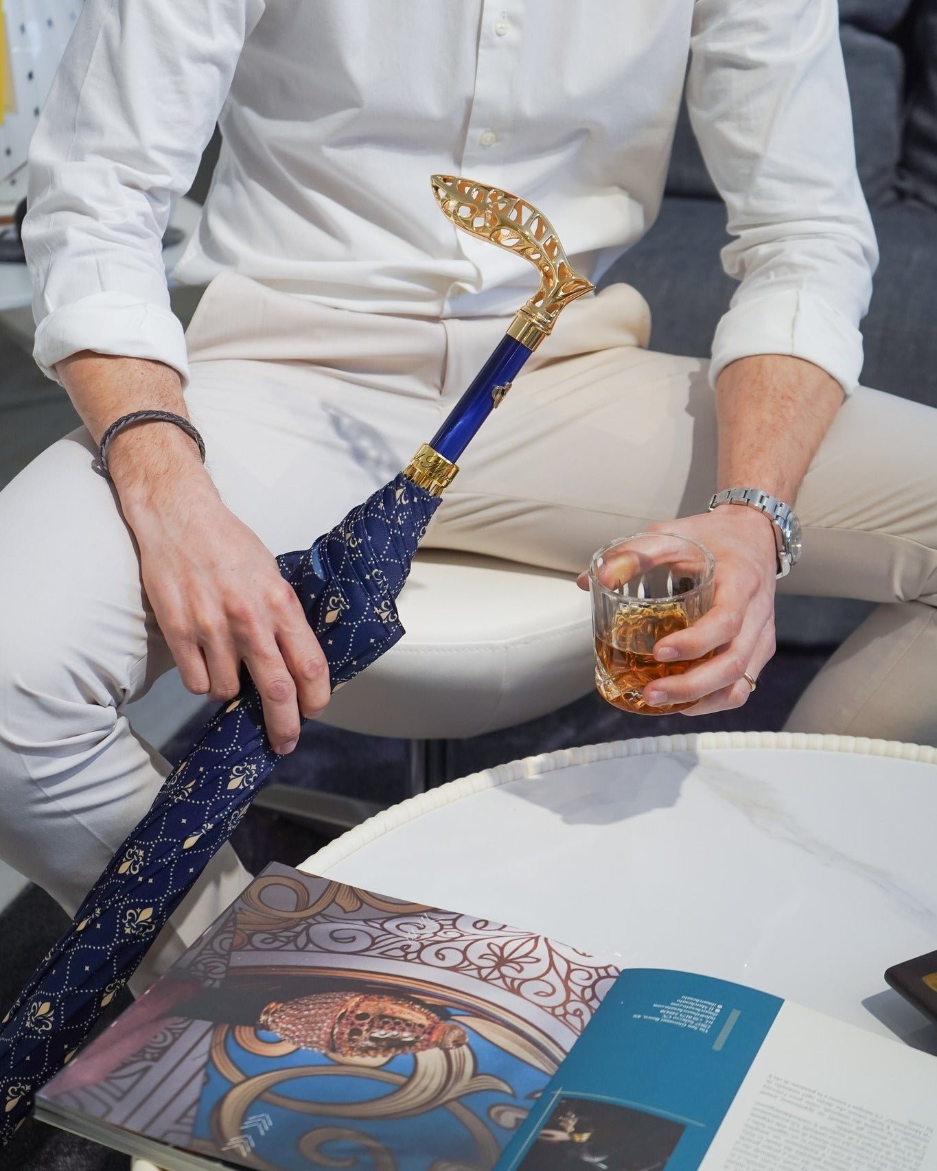Men's luxury handmade Italian rain umbrella with gold-plated handle by Ilmarchesato, featuring a sleek black canopy and stylish design.