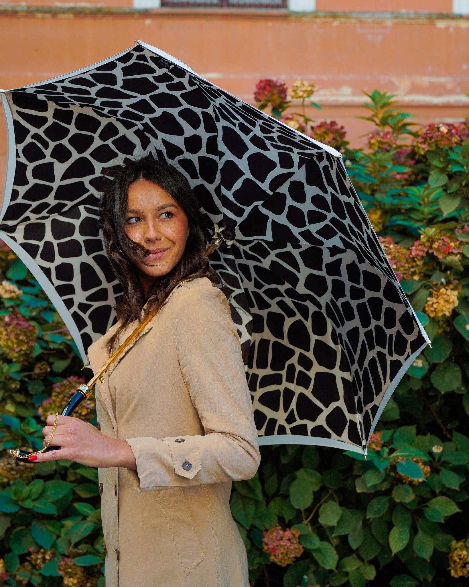 Black cream handcrafted Italian satin rain umbrella with stylish chain handle, featuring a sleek canopy and elegant design.