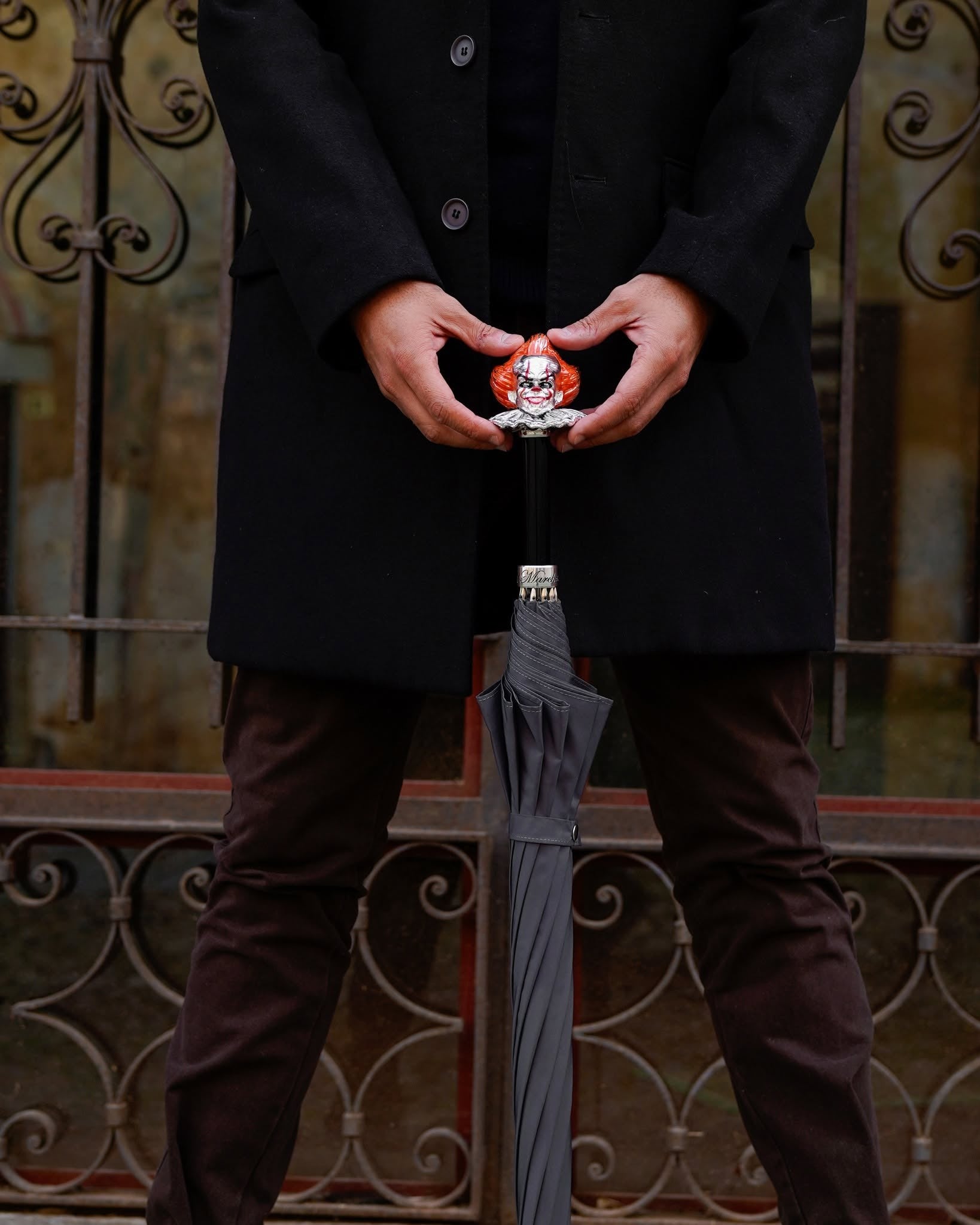 Grey men's umbrella featuring a hand-painted clown handle, crafted by Ilmarchesato with Italian craftsmanship.