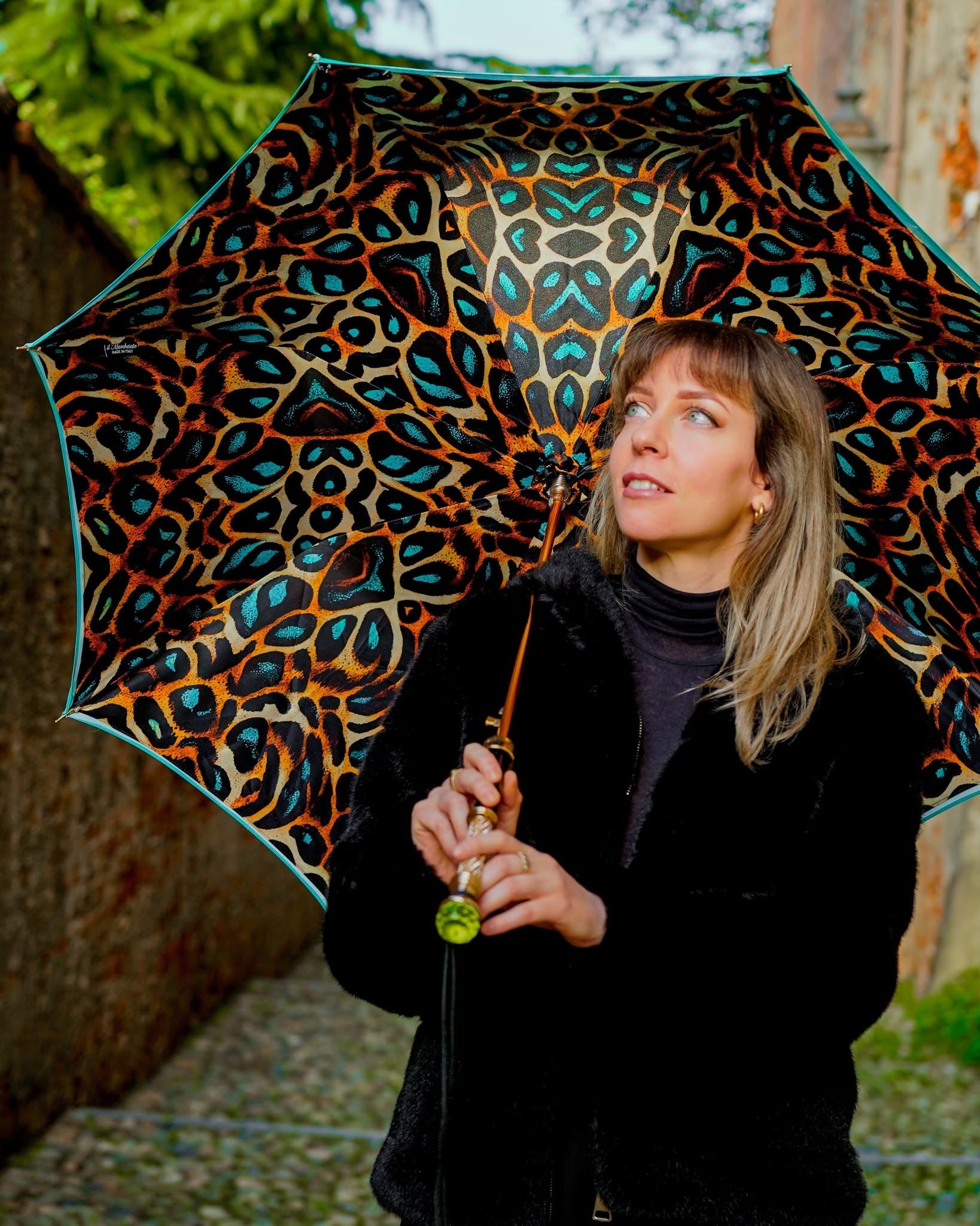 Luxury leopard print rain umbrella by Ilmarchesato with automatic open, 24K gold handle, and green crystal accents.